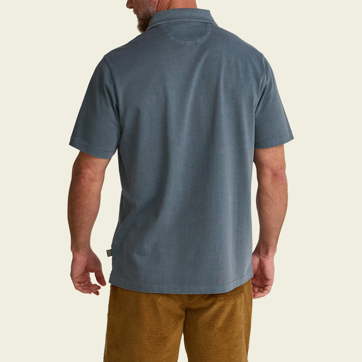 solid cotton polo in Dark Slate, worn on model