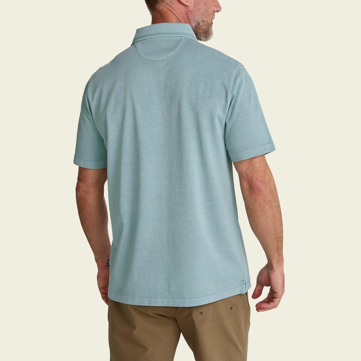 solid cotton polo in Riviera Blue, worn on model